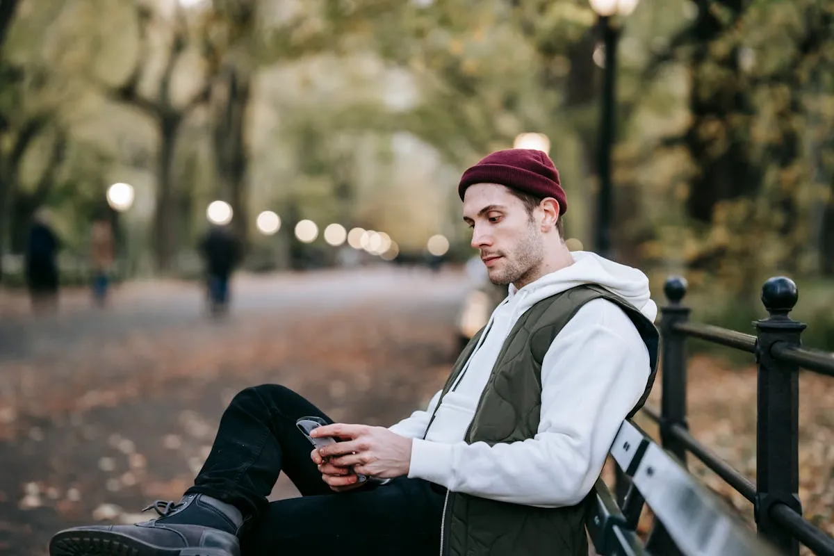 Young man scrolling Instagram on his phone